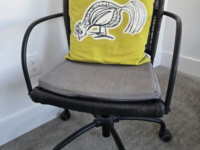 Wicker Rolling Office Chair with Grey Cushion and Yellow Pillow