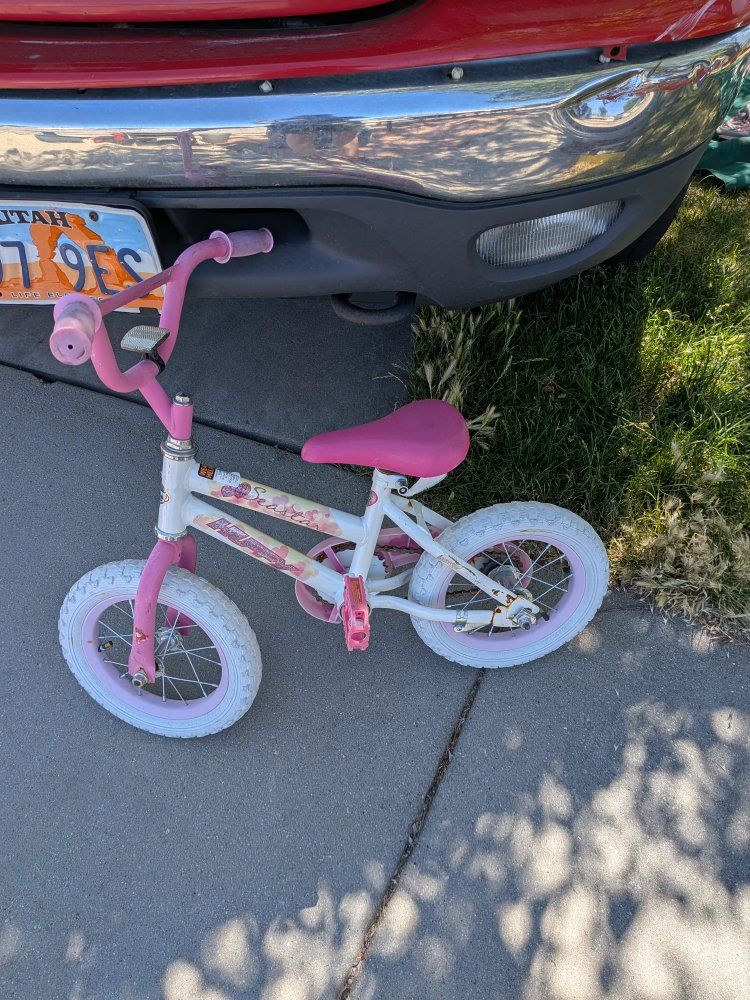 Pink and White Kids' Bicycle - Good Condition, Ready for Fun Rides