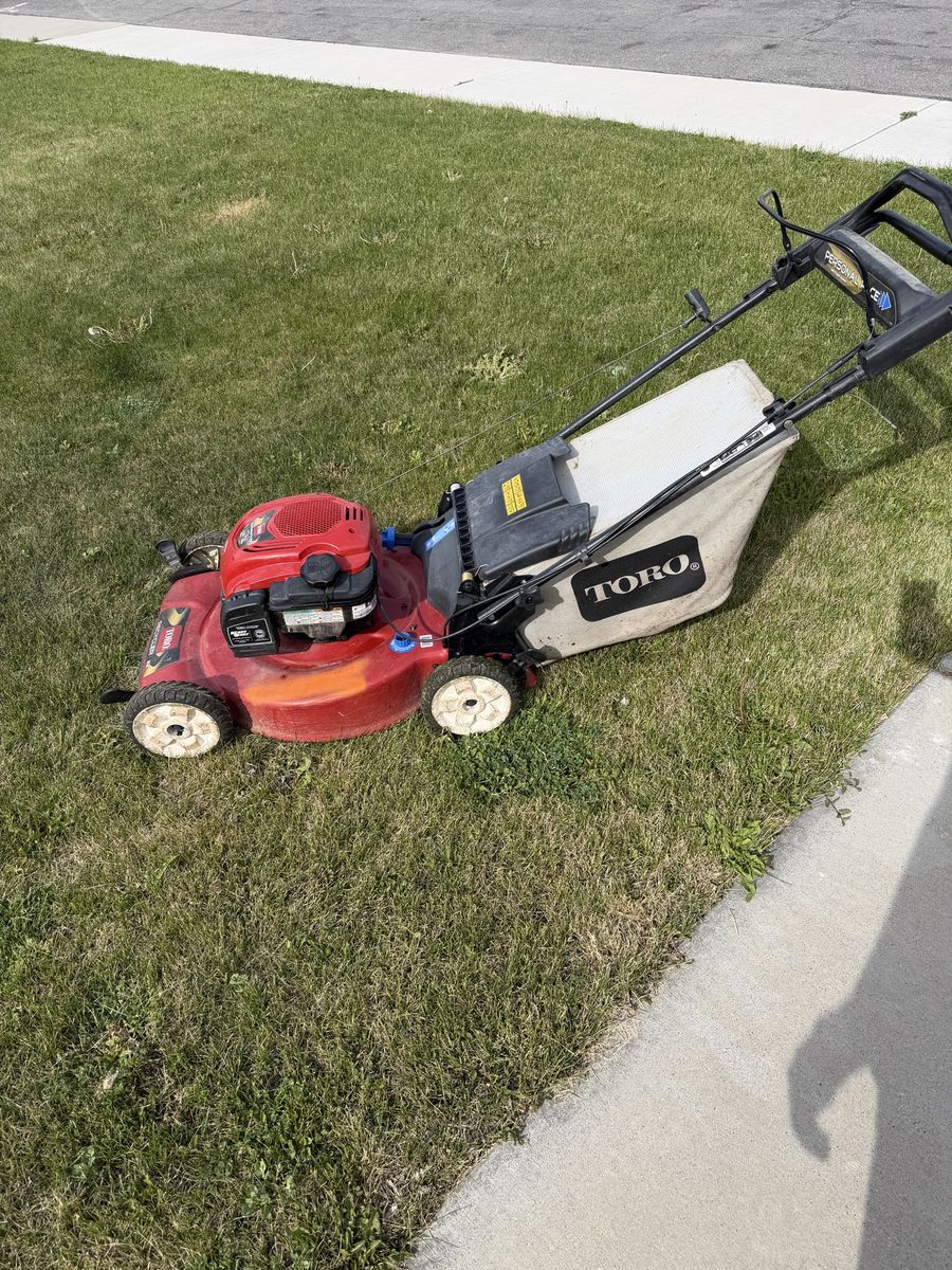 Toro Personal Pace Push Mower - Red Gas Lawn Mower with Bag