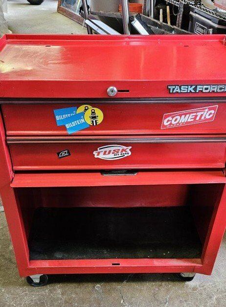 Rolling toolbox full of tools.