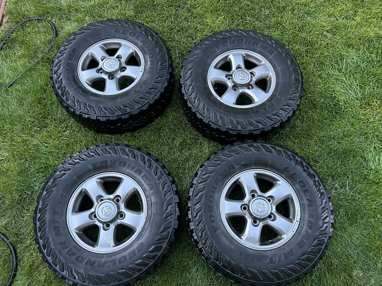 285/75/16 (33 Inch) Yokohama Geolandar G003 M/T tires and Toyota LC Wheels