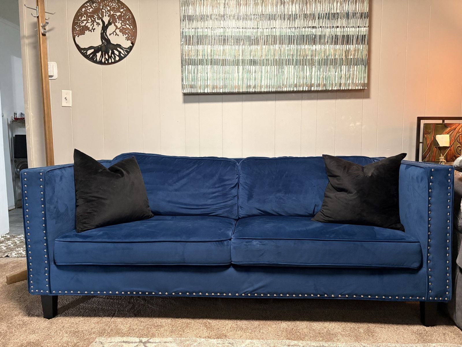 Beautiful Blue Velvet Couch with nailhead trim.