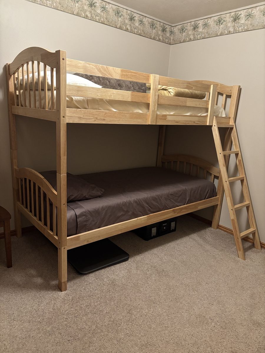 Long Horn Solid Wood Twin Bunk Bed. Just over a year old and barely used. New mattresses included. Can be separated into twins.