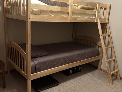 Long Horn Solid Wood Twin Bunk Bed. Just over a year old and barely used. New mattresses included. Can be separated into twins.