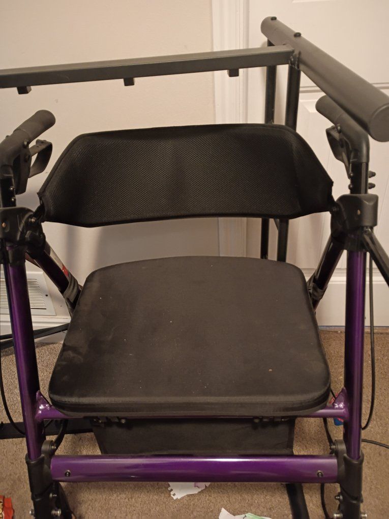 Used Purple Walker with Seat, Brakes, and Storage Bag - Mobility Aid