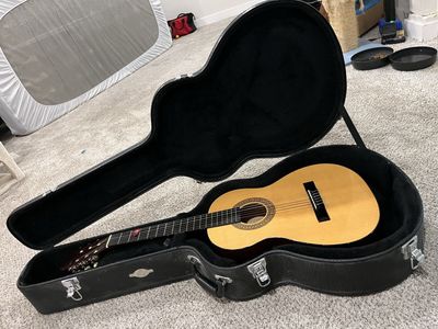 Acoustic Guitar with Hard Case and Pick