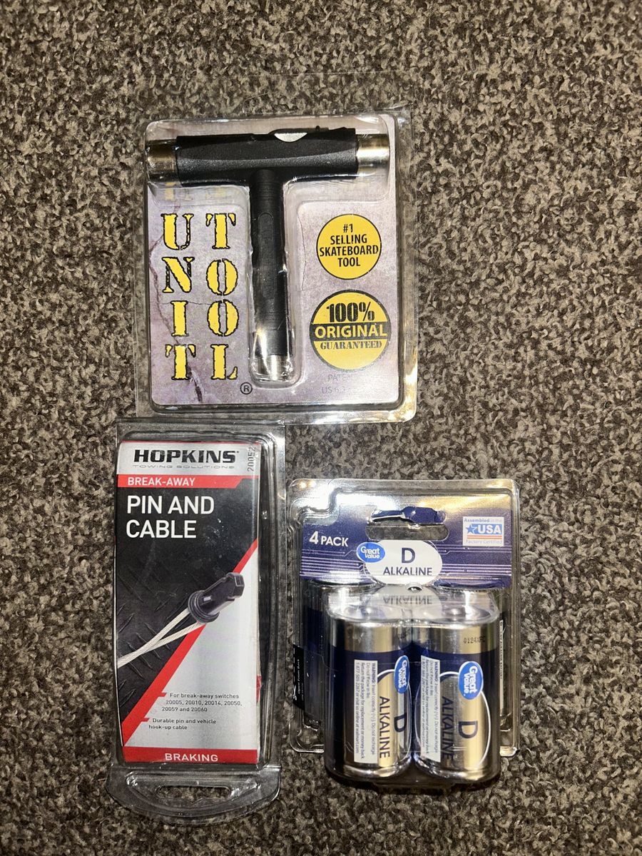 Unopened 4-in-1 Skateboard Tool, Four D4 Batteries, and Break-away Pin & Cable