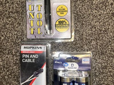 Unopened 4-in-1 Skateboard Tool, Four D4 Batteries, and Break-away Pin & Cable