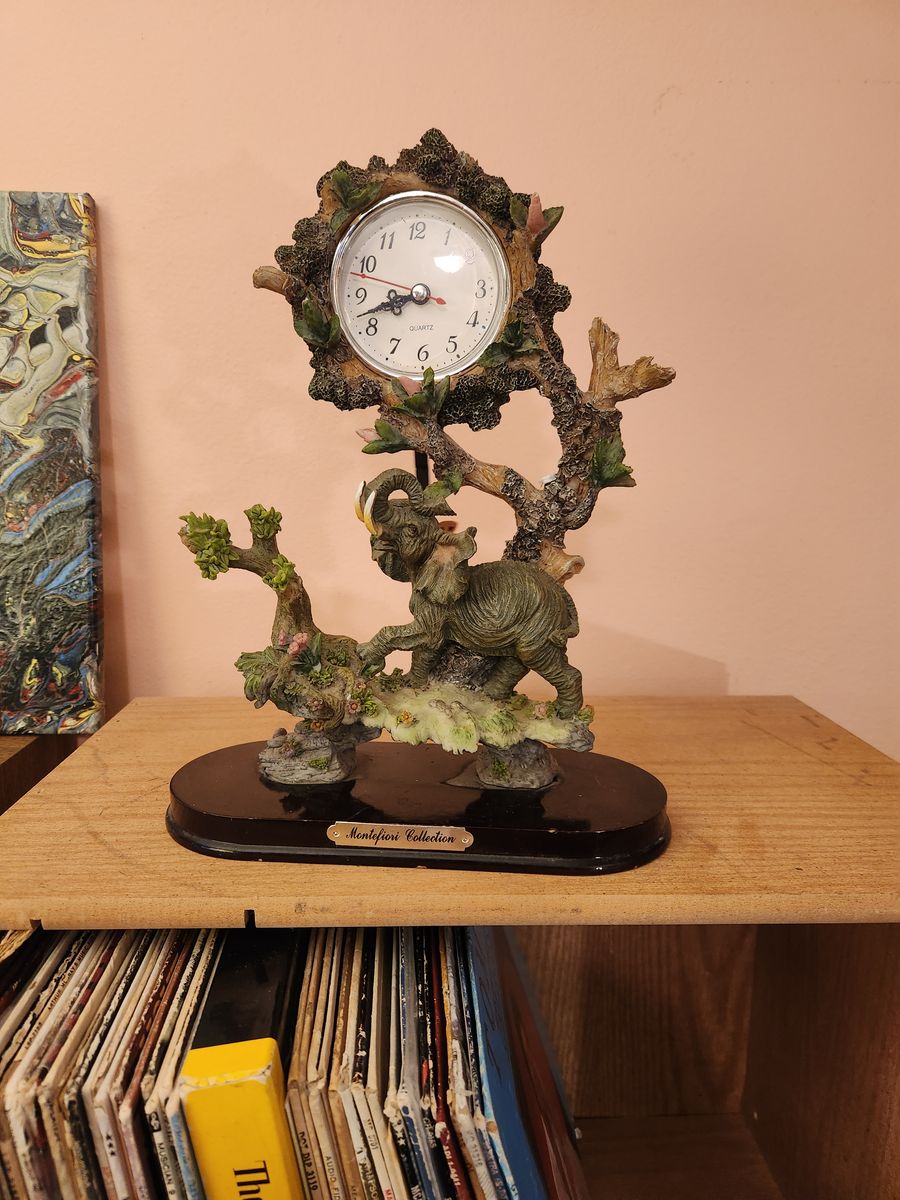 Interesting cool elephant clock...with butterfly pendulum.  Keeps perfect time.  Perfect shape...no chips or anything.