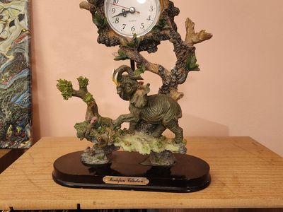 Interesting cool elephant clock...with butterfly pendulum. Keeps perfect time. Perfect shape...no chips or anything.