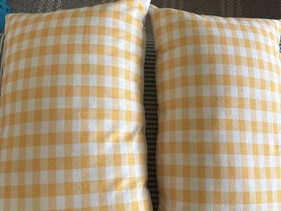 Two yellow gingham pillows