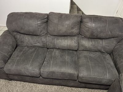 Gray Upholstered Sofa and Loveseat Set with White Stitching
