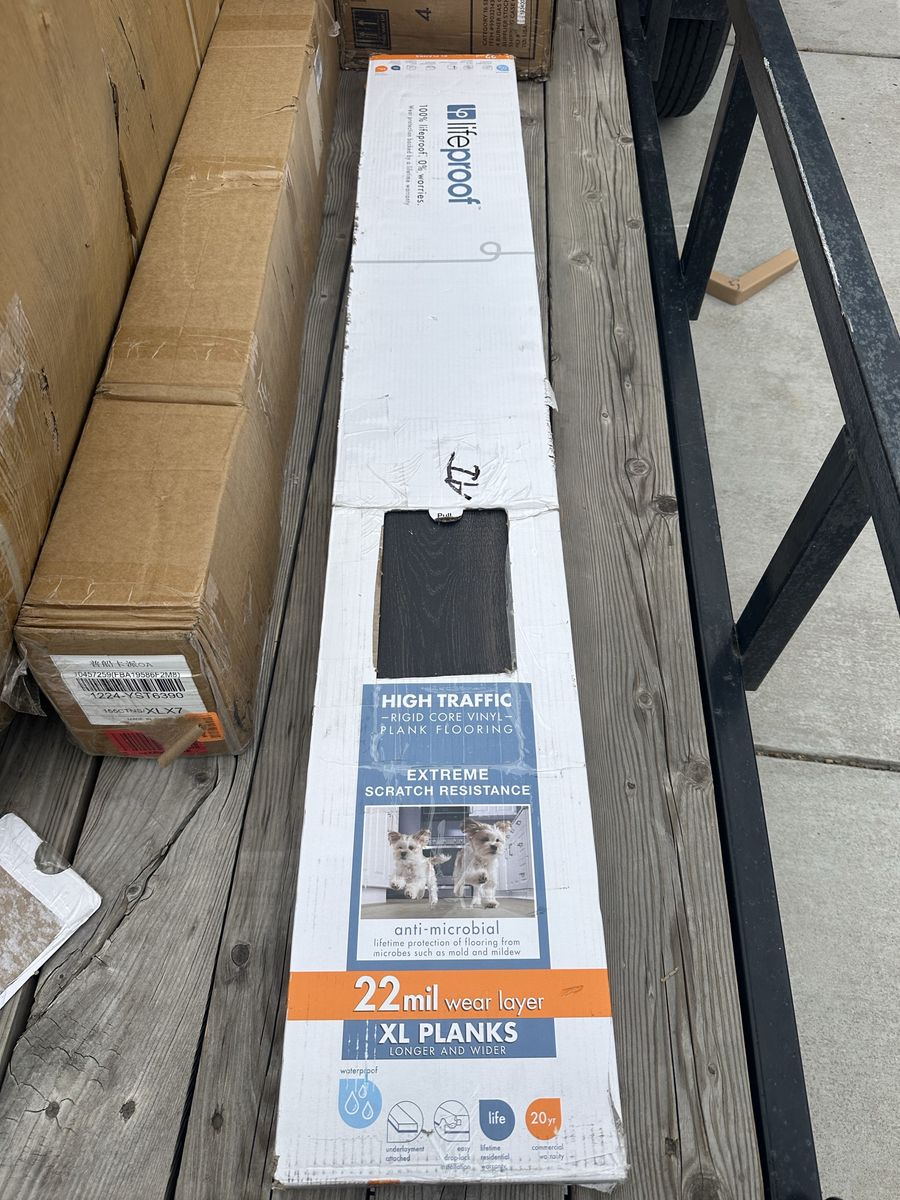Box of Dark Wood Vinyl Planks
