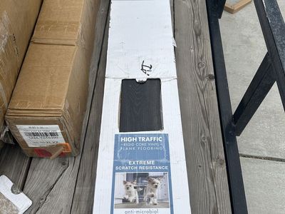 Box of Dark Wood Vinyl Planks