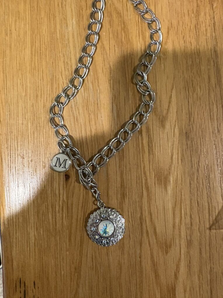 necklace With m Charm And A Different Charm