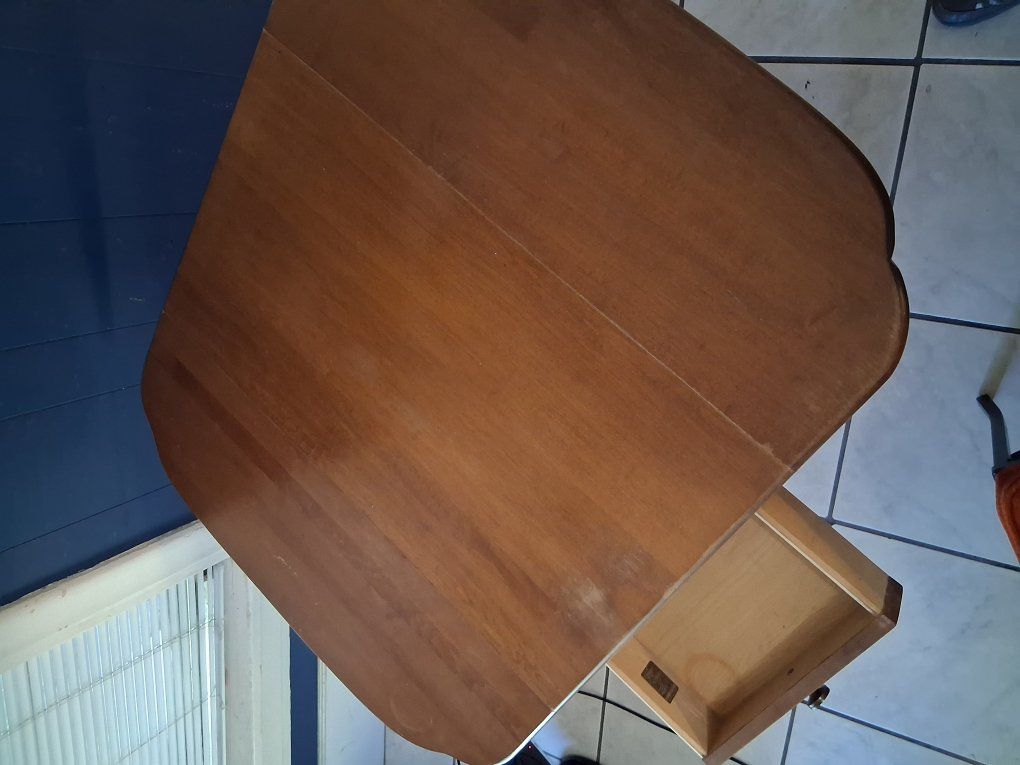 Sewing table with storage drawer.