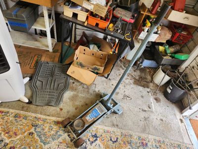 Heavy duty 3 tons floor jack. Works perfect. Can raise a vehicle 18 inches safely. No problems at all.