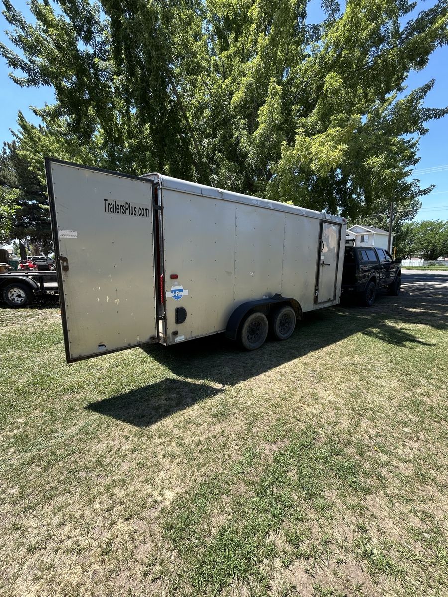 17 ft enclosed and a 24 ft flatbed sled trailer for trade for bigger enclosed