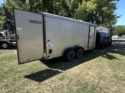 17 ft enclosed and a 24 ft flatbed sled trailer for trade for bigger enclosed