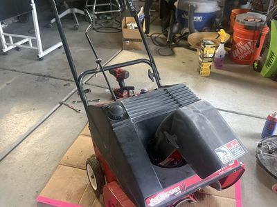 Running Snow Blower