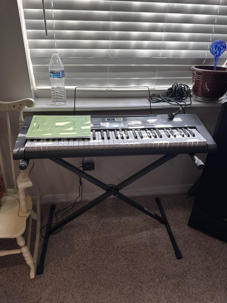 Casio CTK-2400 61-Key Digital Keyboard with Stand and Music Rest