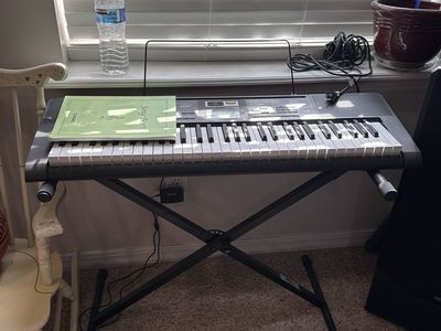 Casio CTK-2400 61-Key Digital Keyboard with Stand and Music Rest