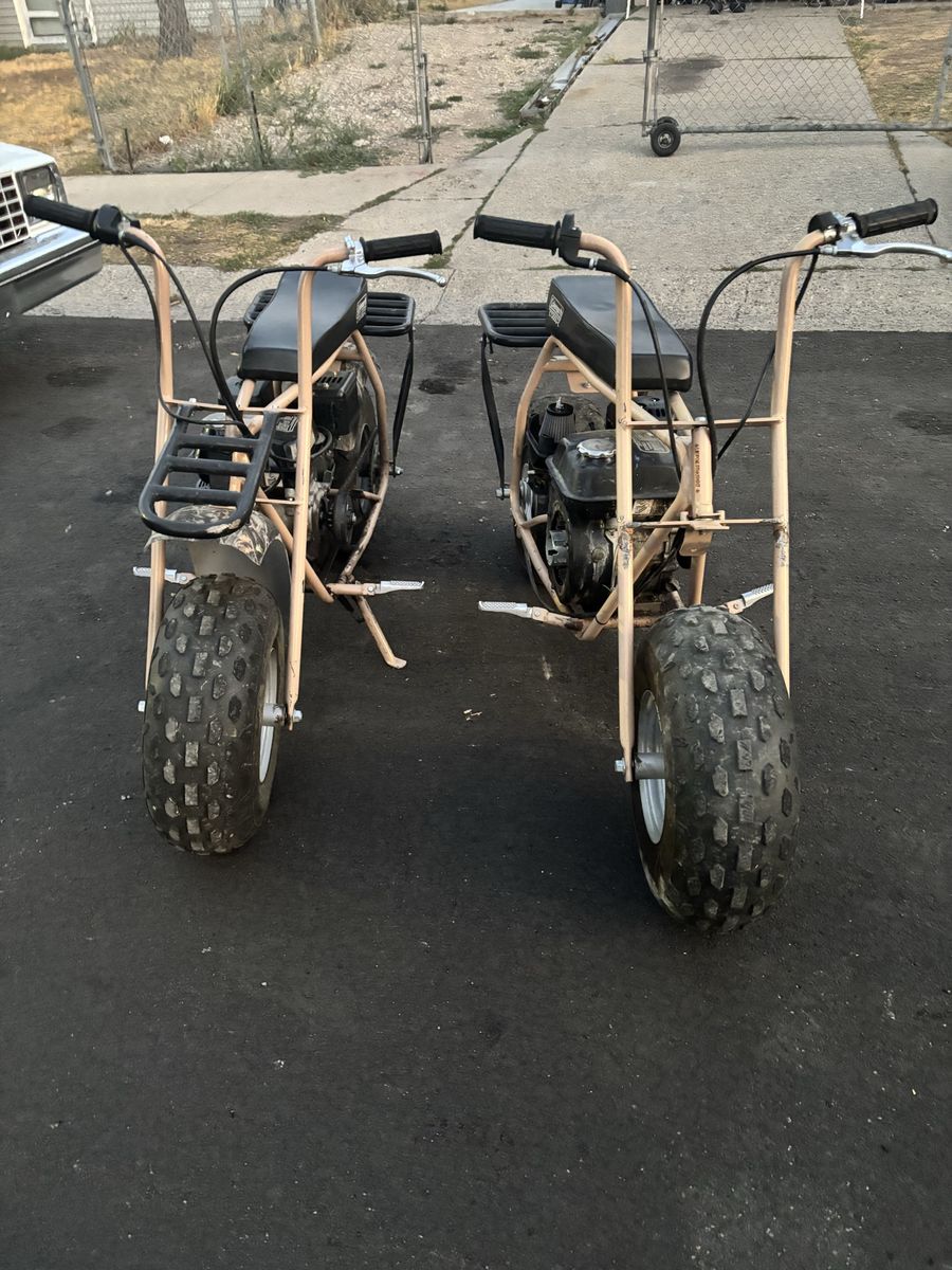 Pair of Coleman Powersports CT200U-C Camo Mini Bikes
