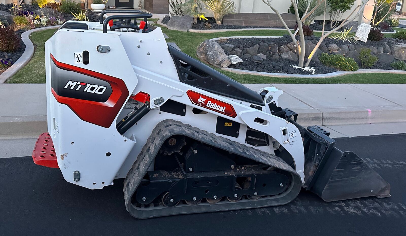 Mini bobcat for rent - trencher & auger attachments