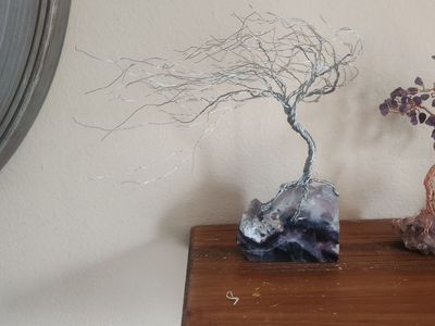 Wire windblown tree natural stone