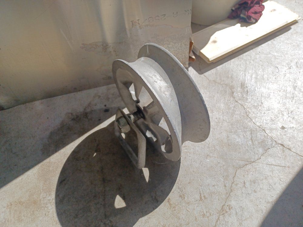 Large aluminum pulley.