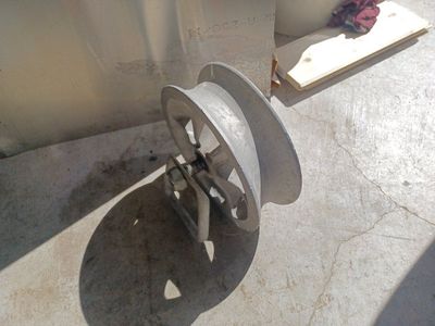 Large aluminum pulley.