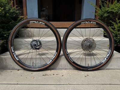 ENVE G23 Chris King Wheels, ENVE Gravel 46cm bar, ENVE bottle cages, Cinturato 45mm gravel tires, SRAM Force D1 Shifters/brakes