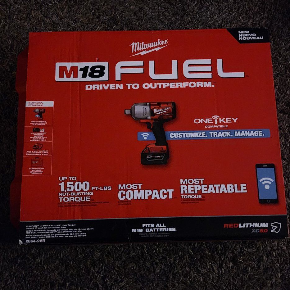 brand new 3/4 Milwaukee impact gun with batteries