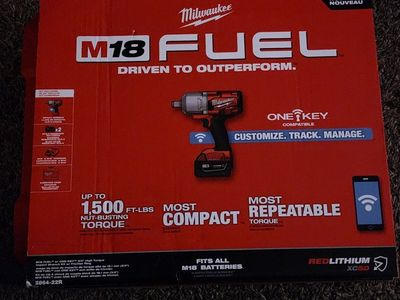 brand new 3/4 Milwaukee impact gun with batteries