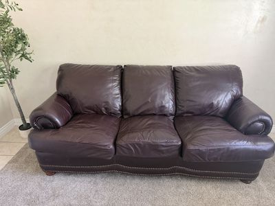 Brown leather couch with pull out bed