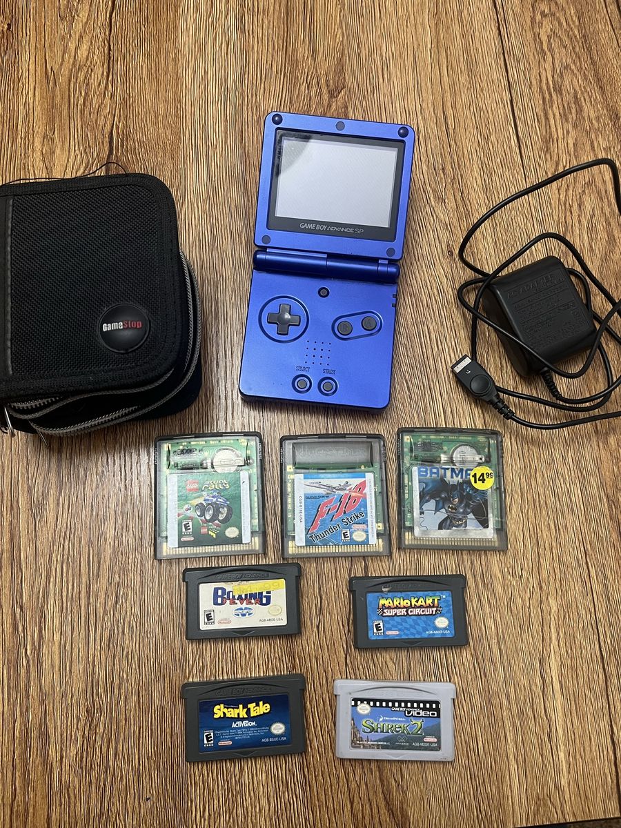 Gameboy Advance SP with charger, 7 games and Case