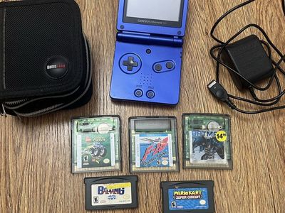 Gameboy Advance SP with charger, 7 games and Case
