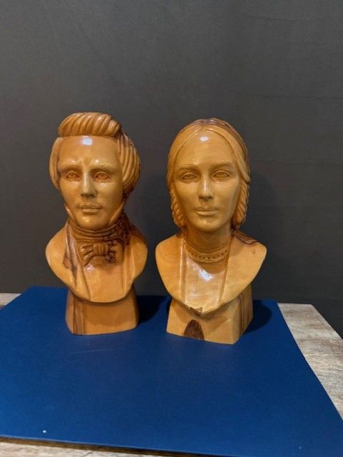 Joseph and Emma Smith busts carved from olive wood by Omar Bakri
