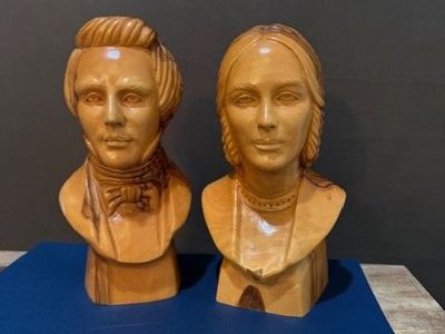 Joseph and Emma Smith busts carved from olive wood by Omar Bakri
