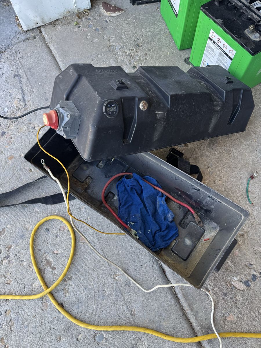6v 225AH batteries, box, shutoff, and voltage meter.