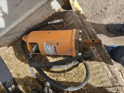 Auger attachment for skid.