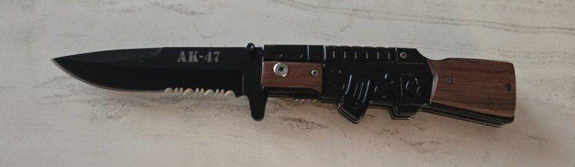 pocket knife new in shape of an AK47 machine gun