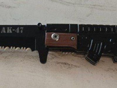 pocket knife new in shape of an AK47 machine gun