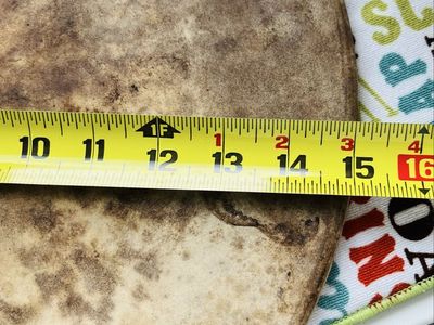 Pampered chef large pizza Stone. Has obvious signs of use but in excellent condition! Does not come with the wire rack.