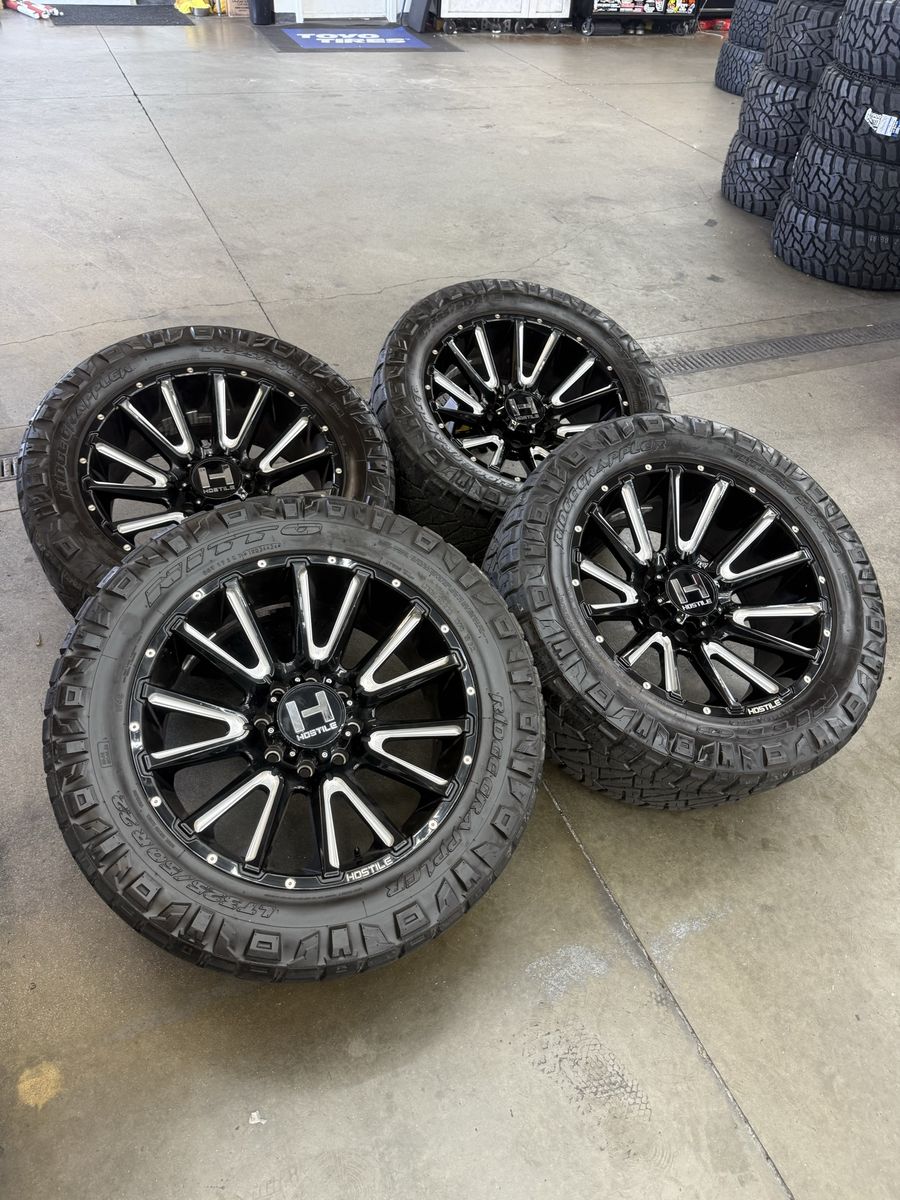 22x10 hostile “typhoon” wheels/ 325/50/22 nittos 8x170