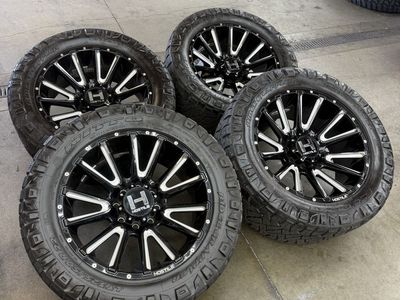 22x10 hostile “typhoon” wheels/ 325/50/22 nittos 8x170