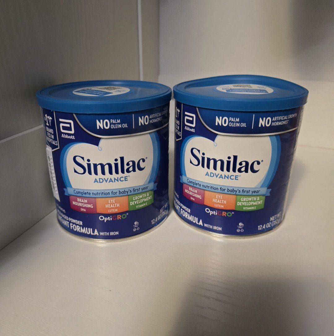 Baby similac formula cans.