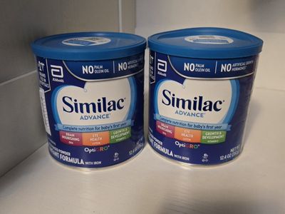 Baby similac formula cans.