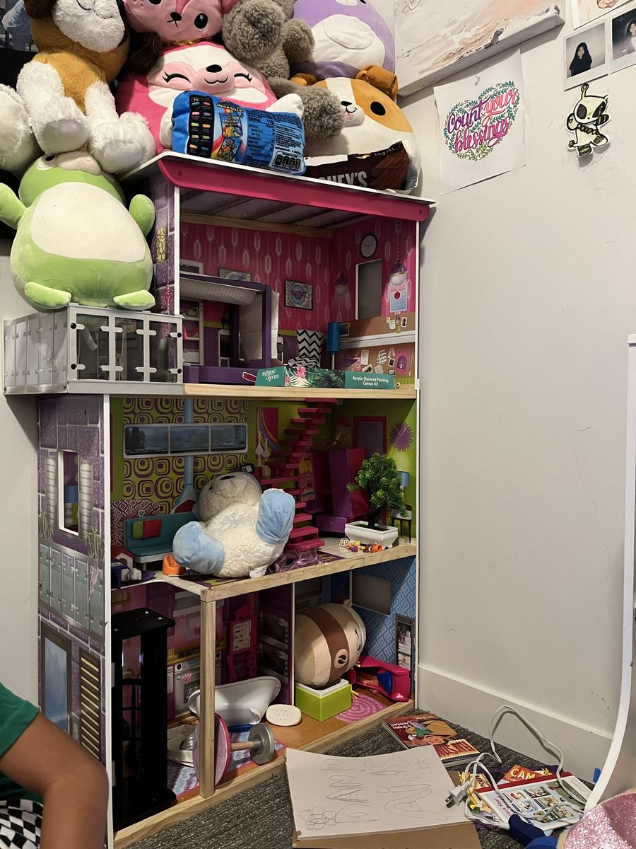 Large Wooden Dollhouse with Multiple Rooms and Balcony
