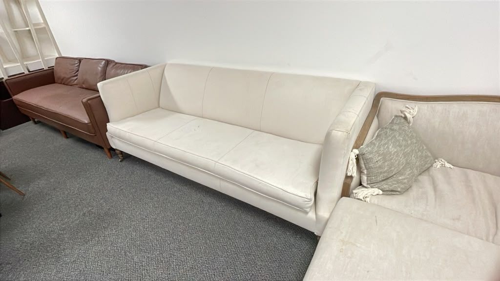 Vintage Light Beige Fabric Sofa with Exposed Stitching & Turned Wooden Legs